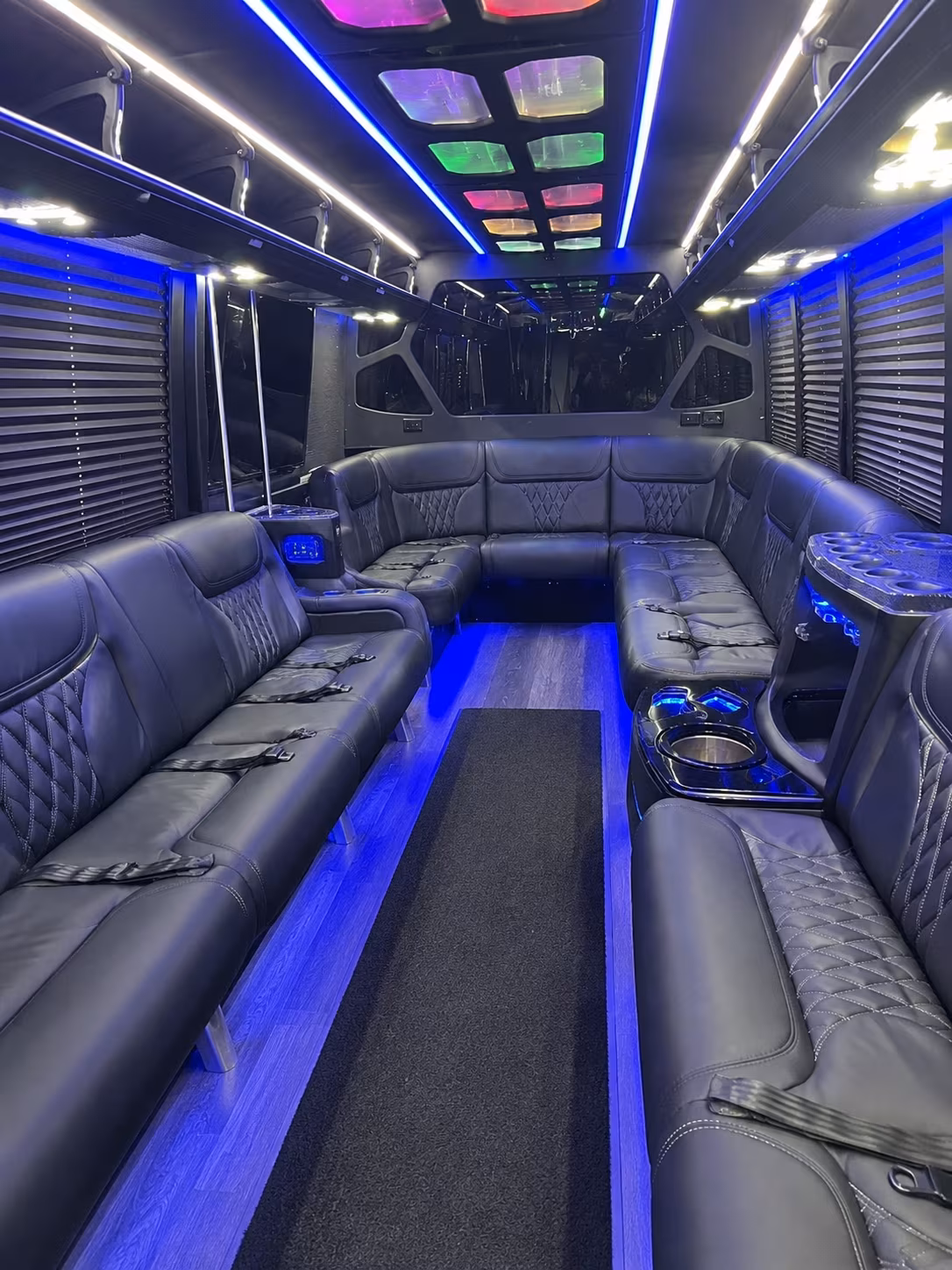 Friends laughing during a party bus celebration in Los Angeles